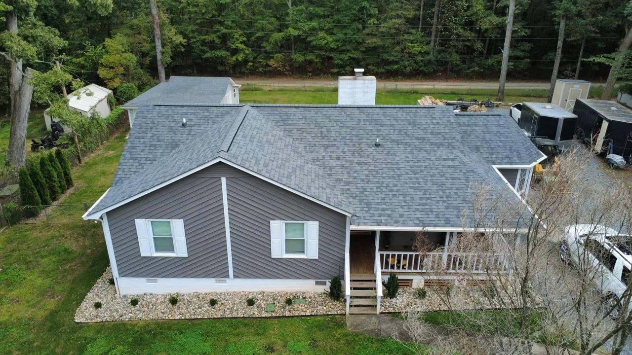 Street-side drone photo of gray architectural shingle roof installed by Local Roofer NC