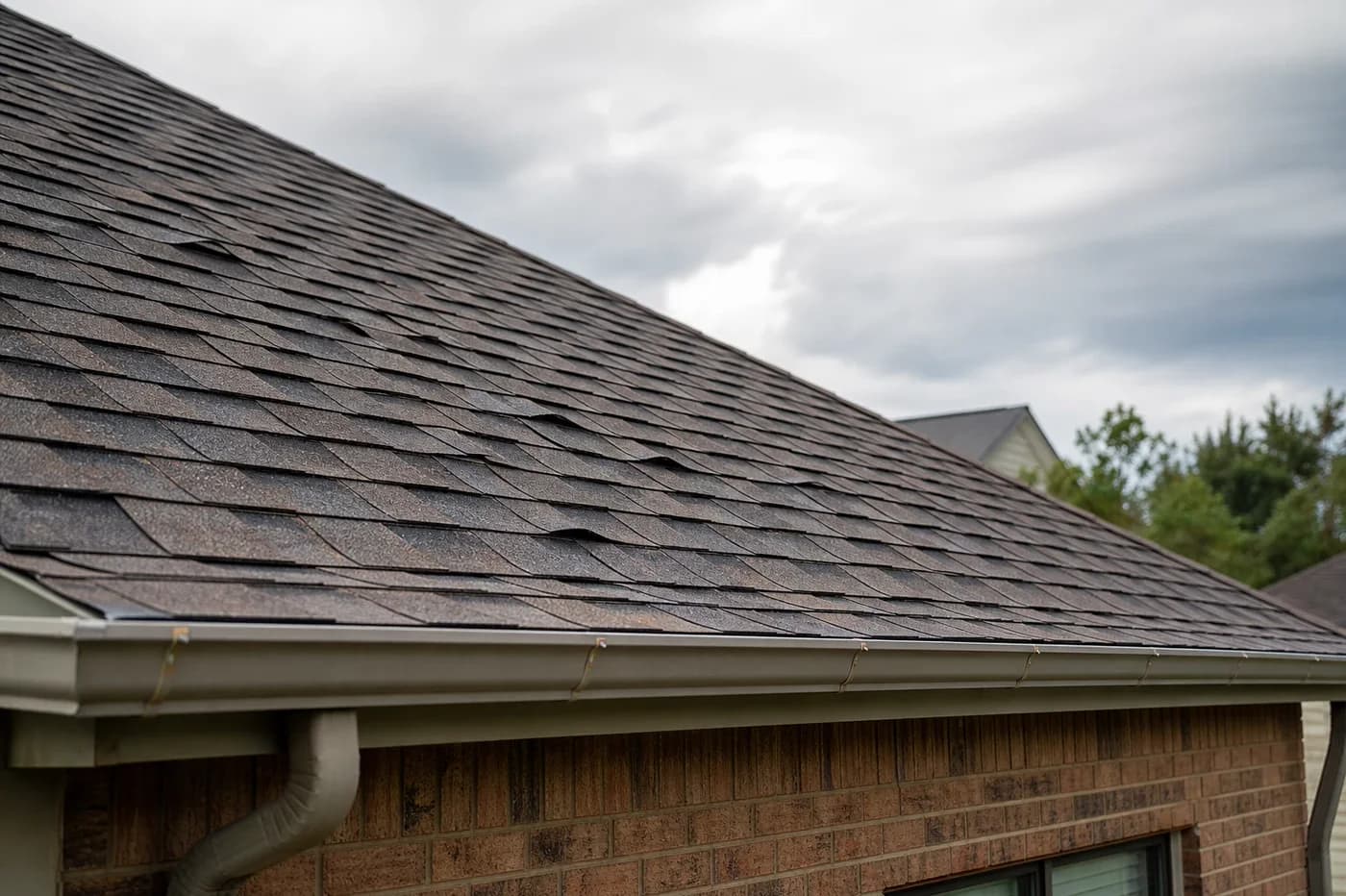 Indian Trail NC asphalt shingle roof with curled and cupped shingle edges that may need inspection